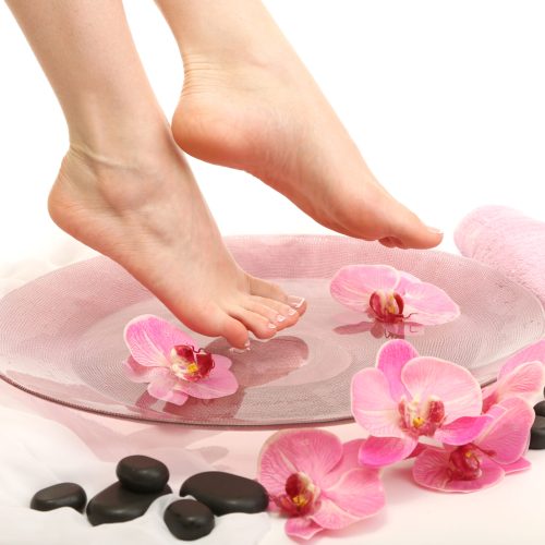 Female,Feet,In,Spa,Bowl,With,Water,,Isolated,On,White Female,Feet,In,Spa,Bowl,With,Water,,Isolated,On,White